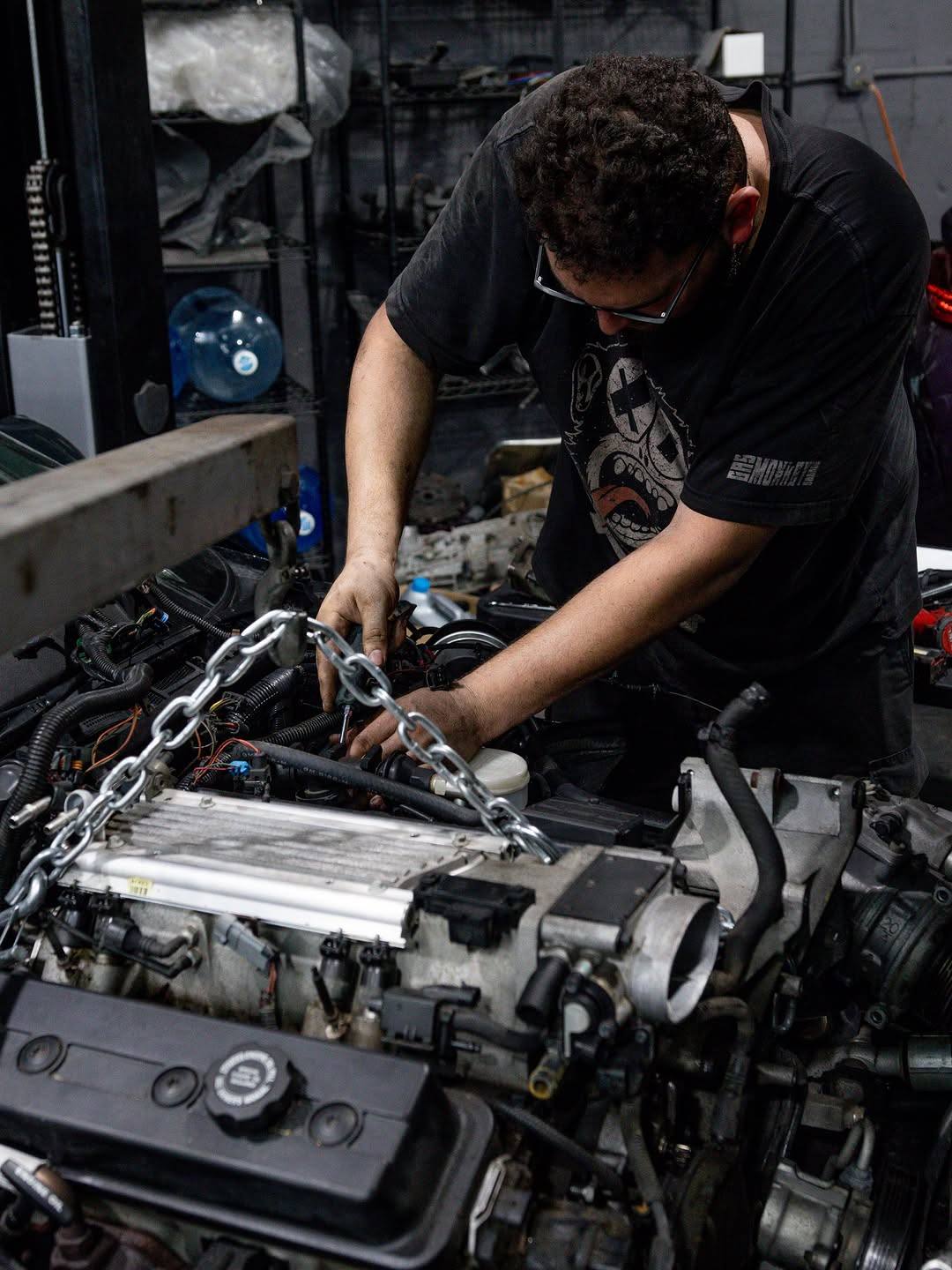 Technician working on an engine