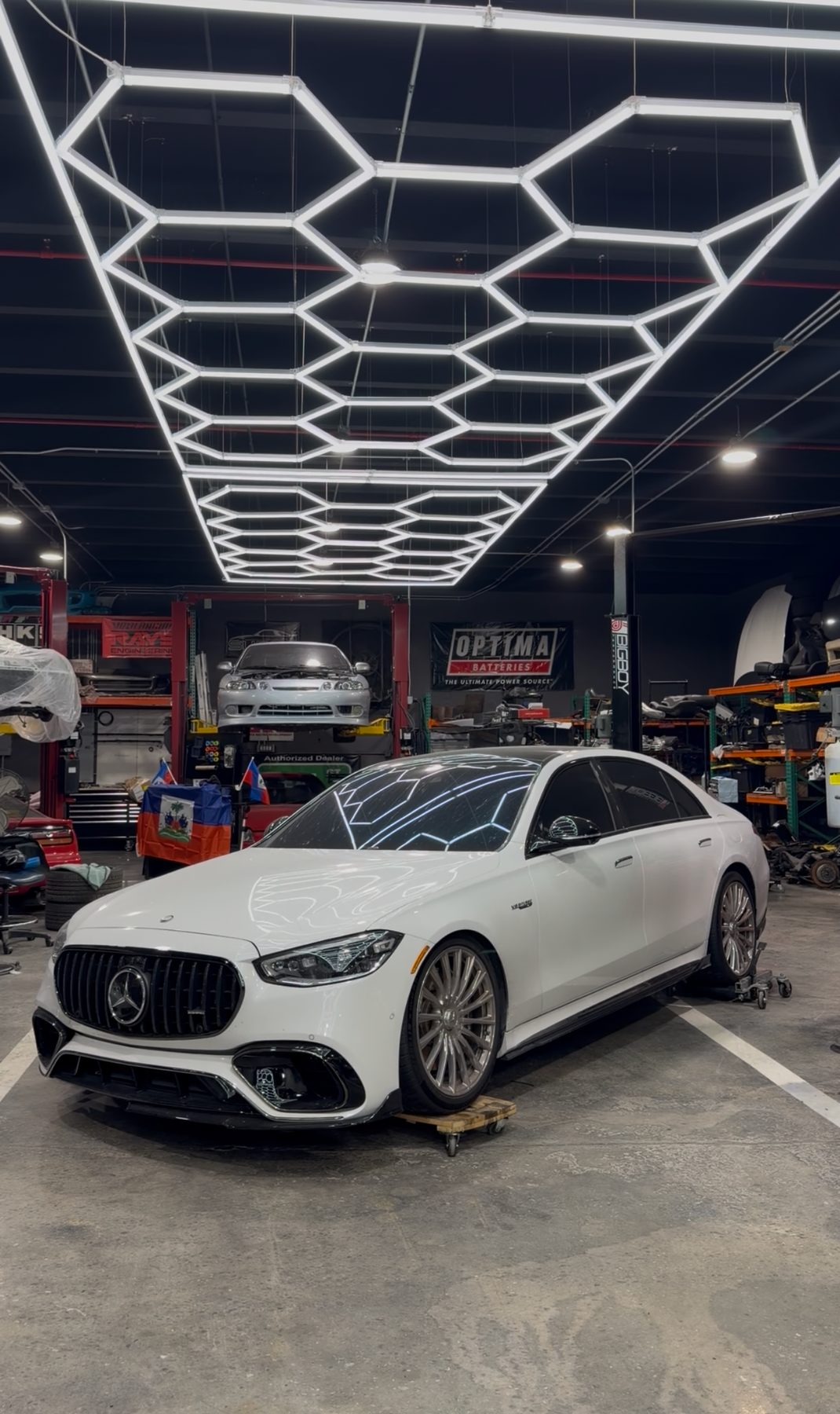 White Mercedes-AMG S-Class inside the Renn shop